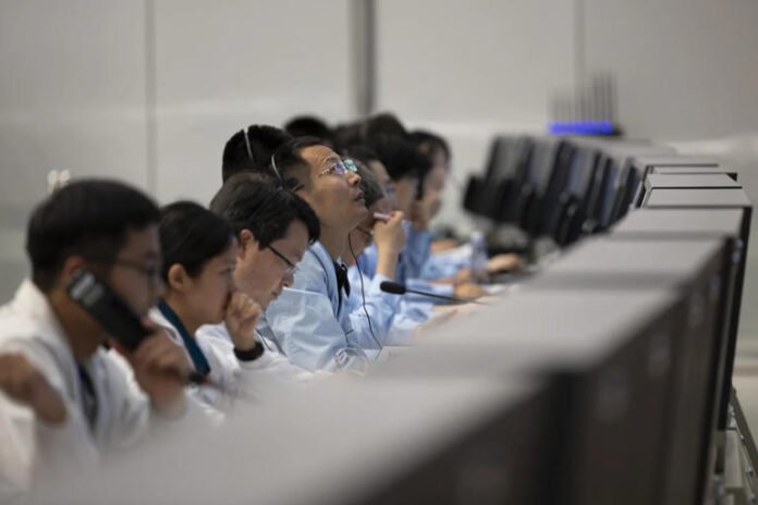 technical personnel work at the Beijing Aerospace Control Centre,