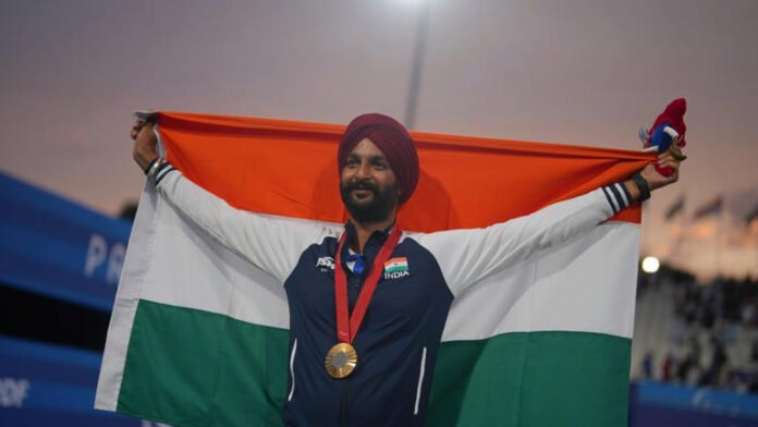 Harvinder Singh of India celebrates after winning the gold medal in the men's Individual Recurve Open at the Paris Paralympics