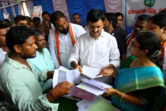 Revenue officials serving legal notices in Bharalkundi village over disputed defense-allotted land