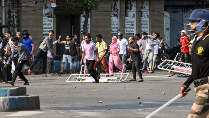 Police personnel during violent eviction-related clashes in Kolkata’s Tiljala area