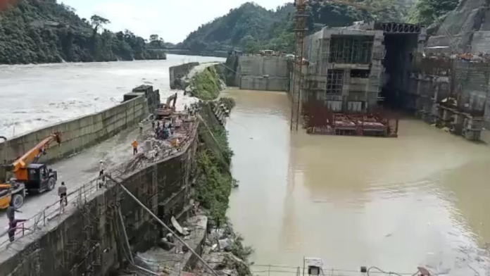 Floodwaters damaging transit infrastructure and surrounding areas in Upper Subansiri during heavy rainfall
