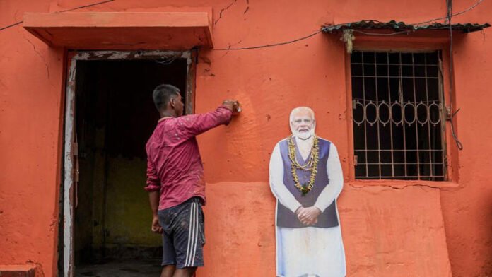 Kolkata: A worker paints over a TMC office after BJP wins the West Bengal Assembly elections, in Kolkata, West Bengal, Tuesday, May 5, 2026