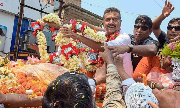 Suvendu Adhikari addressing a roadshow crowd in Falta while commenting on the election contest