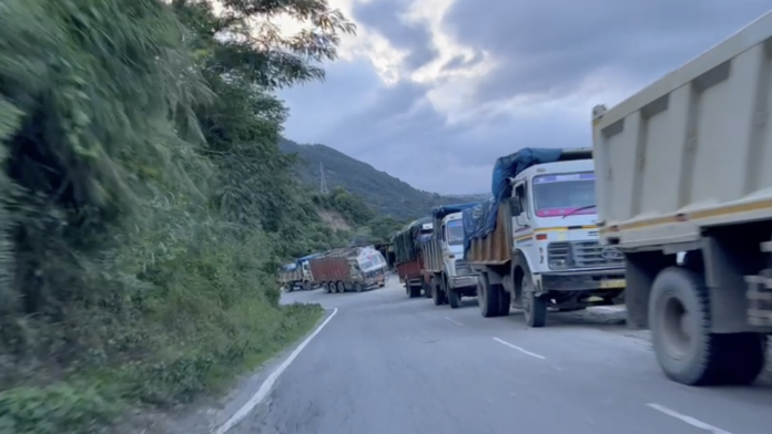 Stranded trucks and halted traffic on National Highway-2 during Manipur blockade protests