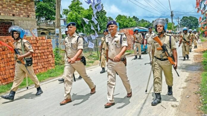 Security personnel and emergency responders near the Sonamura border area following a firing incident involving an injured youth