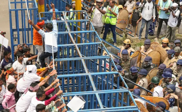 Protesters and police presence near Park Circus Seven Point Crossing during demonstrations over demolition operations in Kolkata