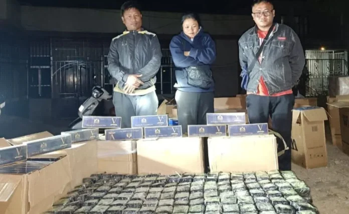 Security personnel monitoring a border checkpoint in Mizoram as authorities discuss stricter regulations against liquor and drug smuggling.