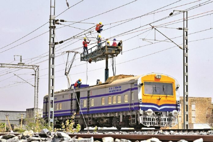 Electric train operating on newly electrified broad-gauge railway tracks in Northeast India under NFR modernization project.