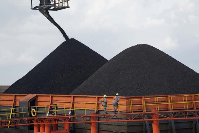 Coal is loaded onto a barge in East Kalimantan, Indonesia.