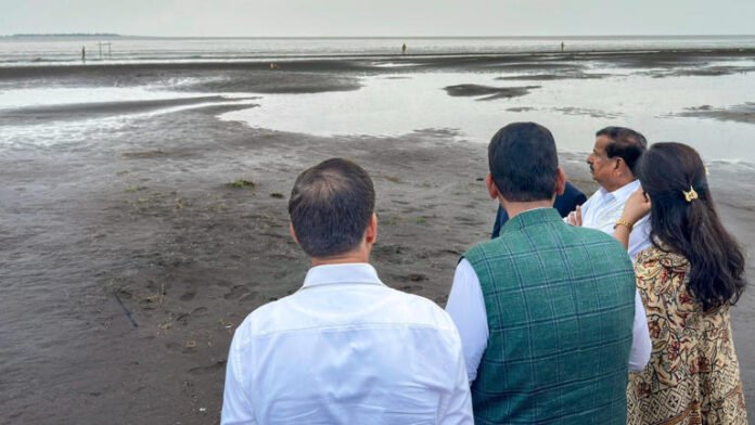 Maharashtra Chief Minister Devendra Fadnavis inspects the site and layout of the proposed offshore airport, at Palghar.