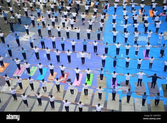 School athletes and NCC cadets performing yoga exercises during the pre-International Yoga Day event at Heritage Park in Agartala.