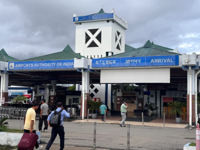 Passengers move through upgraded facilities at Imphal International Airport during the observance of Yatri Suvidha Diwas.