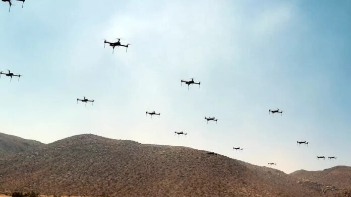 Security forces operating advanced drones over valley-hill boundary regions in Manipur for real-time surveillance monitoring.