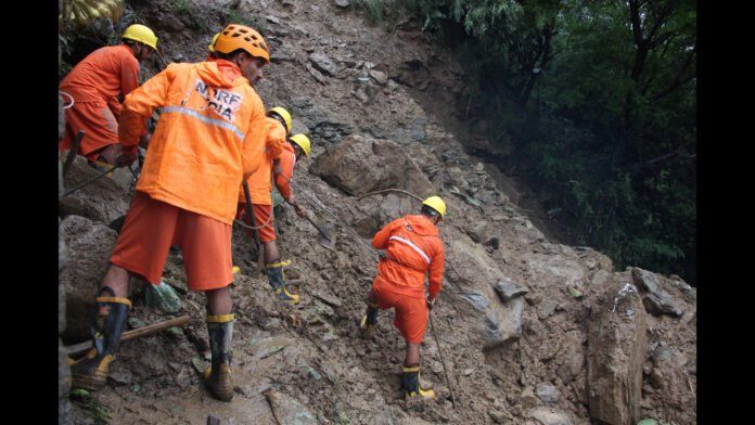 Emergency responders attending to victims during the Migging Landslide Injury Crisis following a severe accident near Migging.