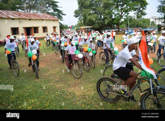 Participants riding bicycles during Cyclothon 2026 at Tripura University under the Agartala Khel Mahotsav banner.