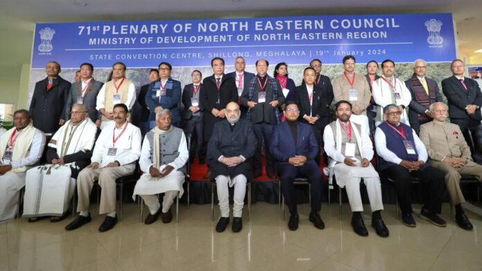 Amit Shah addressing delegates at the NEC Plenary Session while discussing the transformation of Northeast India.