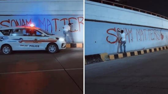 AA282MPM An artist writing 'Sonam Matters' in Delhi.