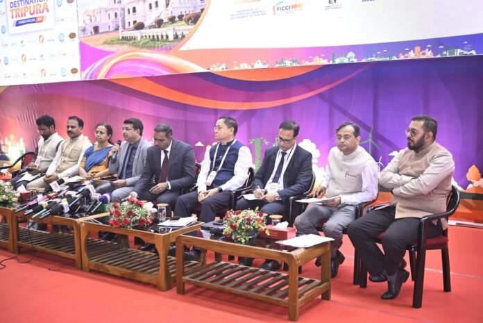 Government officials and industry representatives exchange signed Memorandums of Understanding during the Destination Tripura Business Conclave 2026.