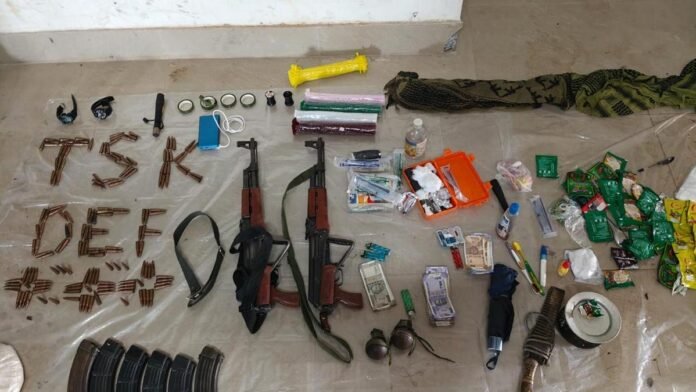 Assam Police display seized assault rifles after arresting two alleged ULFA(I) cadres in Tinsukia.