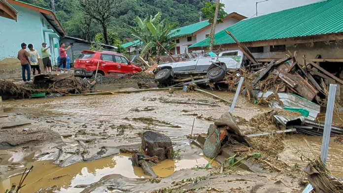 Floodwaters and landslide debris damaging roads and bridges in Arunachal Pradesh during the severe monsoon disaster.