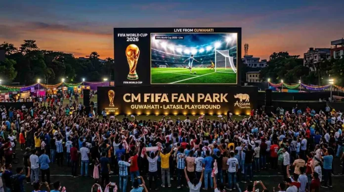 Football fans gather at a large outdoor screen during a FIFA World Cup fan park event in Assam with festive decorations and community celebrations.
