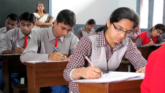 Students preparing for Tripura Board supplementary examinations at designated examination centers under the Bochor Bachao initiative.