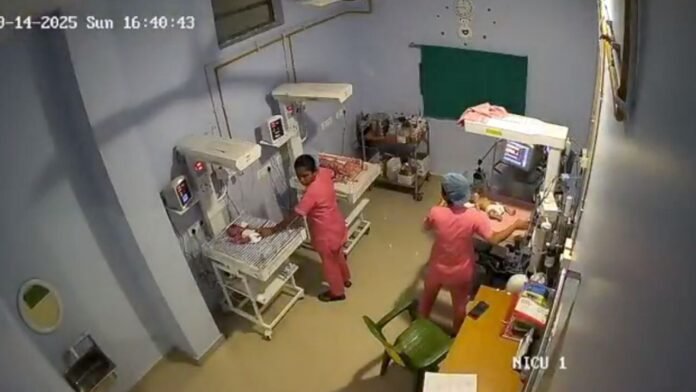 Doctors and healthcare workers caring for newborns in a neonatal intensive care unit during a health department review in Assam.
