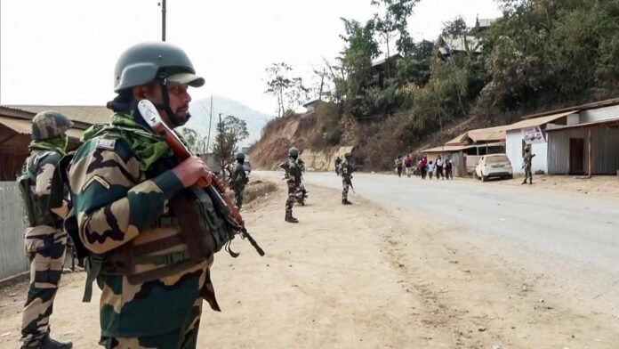 Security personnel secure an area in Ukhrul district following an attack on an Assam Rifles patrol.