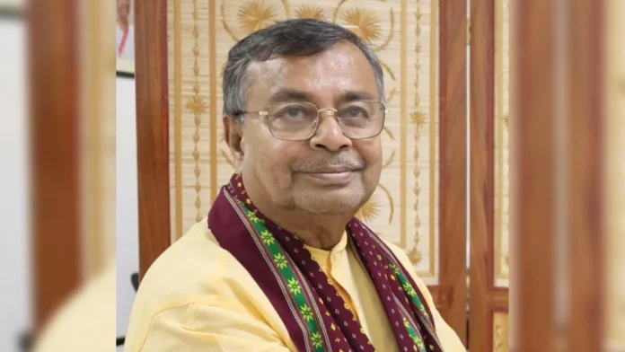 Parliamentary Affairs Minister Ratan Lal Nath addresses a gathering while announcing government jobs for family members of victims of historical political violence.