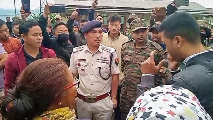 Security forces conducting a rescue operation in a remote area of Manipur to recover two abducted men from Assam.