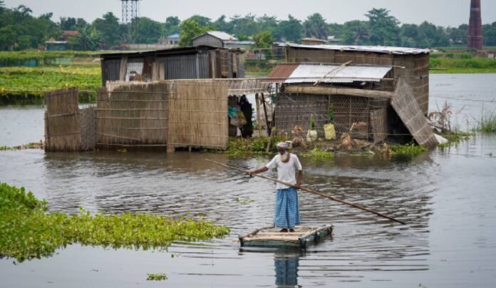 Flood-affected areas in Dhemaji district, Assam, with displaced residents seeking shelter in relief camps.