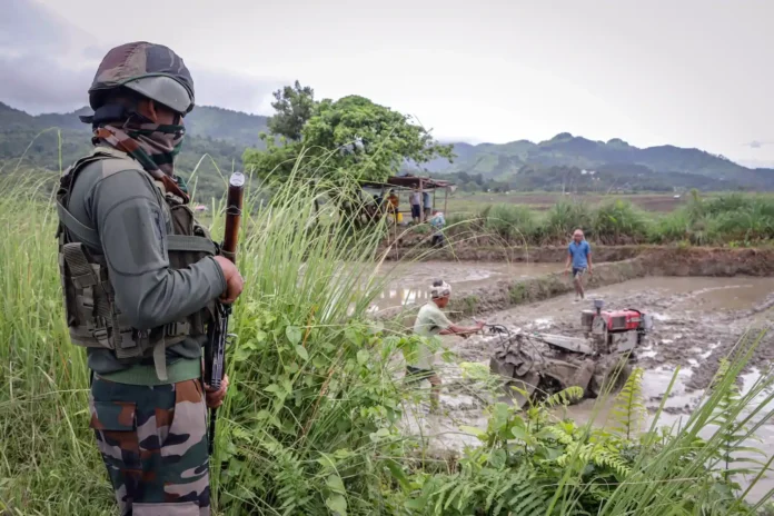 Security personnel from Assam and Nagaland monitor a border area through a newly established joint observation outpost.