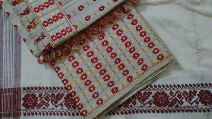 Traditional Muga Silk artisans and weavers showcasing premium silk products under Assam's global branding initiative.