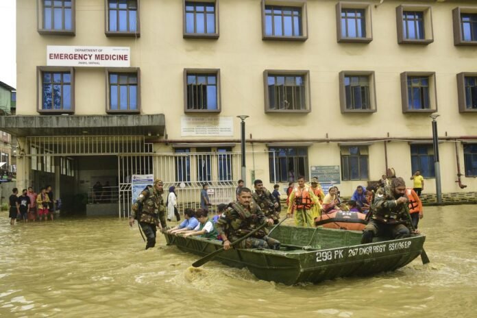 Senior government officials and disaster management personnel coordinating emergency support operations for Northeast India during the monsoon season.