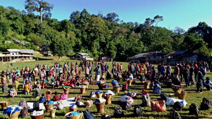 Civil society volunteers arrange basic shelter amenities for displaced families from Myanmar in Mizoram.