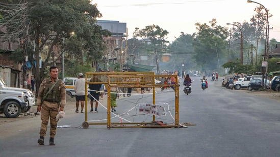 AA2fN3dG A security person stands near a barricade during a 48-hour statewide shutdown called by the Native People's Committee Manipur (NPCM) to protest the killing of three civilians and demand action against those responsible for the attack, at Lamlong in Imphal East.
